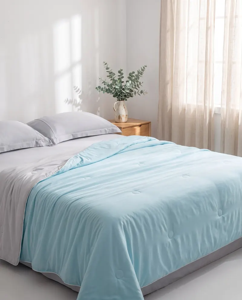 Snoozeloom cooling doona on a bed in a bright bedroom